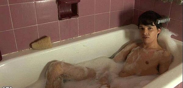  Nude boy having fun stroking off in a bubble bath